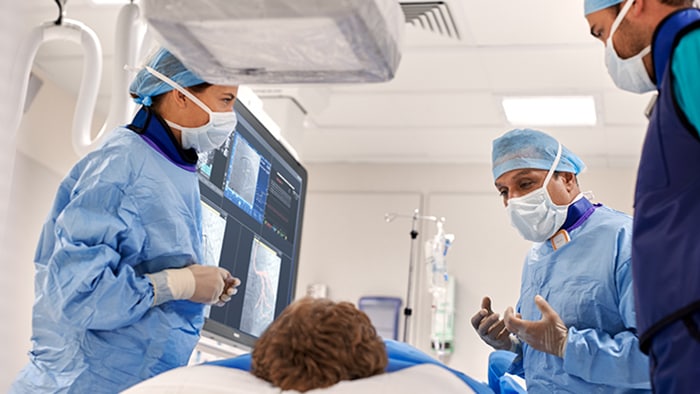 Interventional cardiologists looking at clinical images